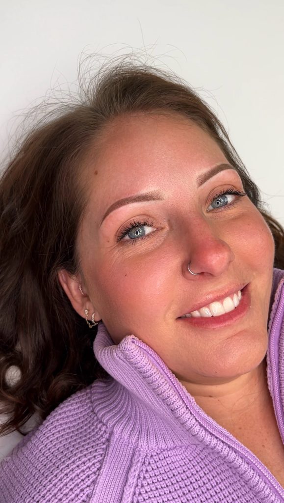 Healed Ombré powder brows on a smiling client at Beauty Room Ink.